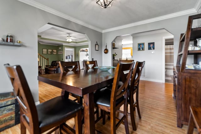 1383 Smith Chapel Rd, Shelbyville, TN 37160 - dining area with light wood-type flooring, stairway, ceiling fan, baseboards, and ornamental molding