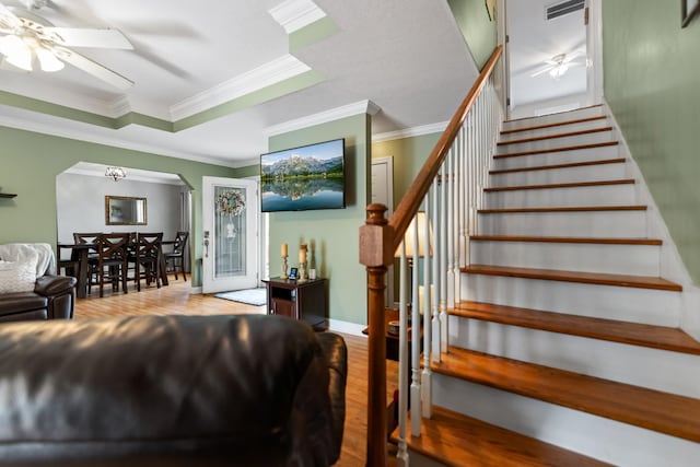 1383 Smith Chapel Rd, Shelbyville, TN 37160 - stairs featuring a ceiling fan, arched walkways, wood finished floors, ornamental molding, and baseboards