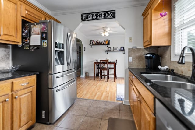 1383 Smith Chapel Rd, Shelbyville, TN 37160 - kitchen featuring arched walkways, stainless steel fridge, ornamental molding, ceiling fan, and a sink