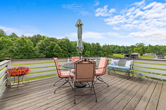 1383 Smith Chapel Rd, Shelbyville, TN 37160 - wooden terrace with outdoor dining space and view of wooded area