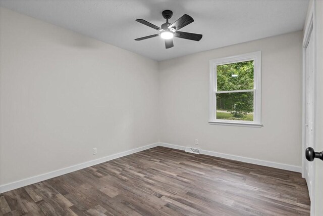 1079 Hillcrest Rd, Waverly, TN 37185 - spare room featuring dark wood-style floors, baseboards, and a ceiling fan