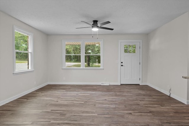 1079 Hillcrest Rd, Waverly, TN 37185 - entryway with wood finished floors, a textured ceiling, a ceiling fan, and baseboards