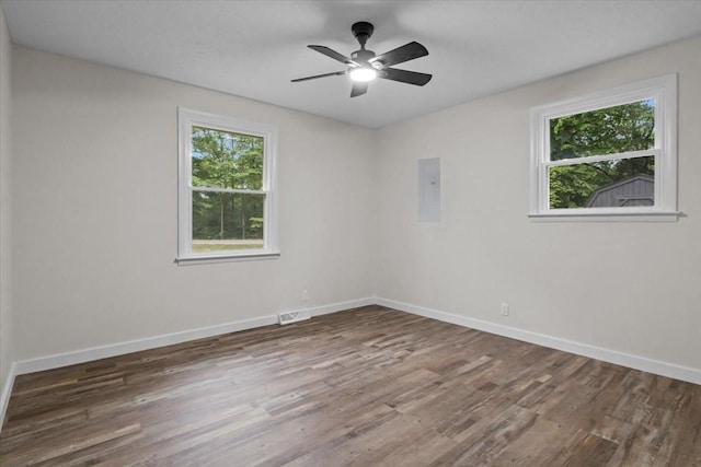 1079 Hillcrest Rd, Waverly, TN 37185 - spare room with healthy amount of natural light, wood finished floors, and baseboards