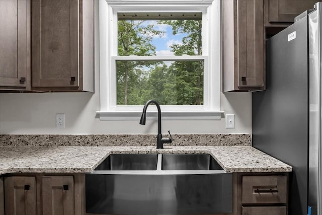 1079 Hillcrest Rd, Waverly, TN 37185 - kitchen featuring a sink, freestanding refrigerator, plenty of natural light, and dark brown cabinetry