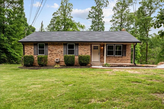 1079 Hillcrest Rd, Waverly, TN 37185 - single story home with a front lawn, brick siding, and roof with shingles