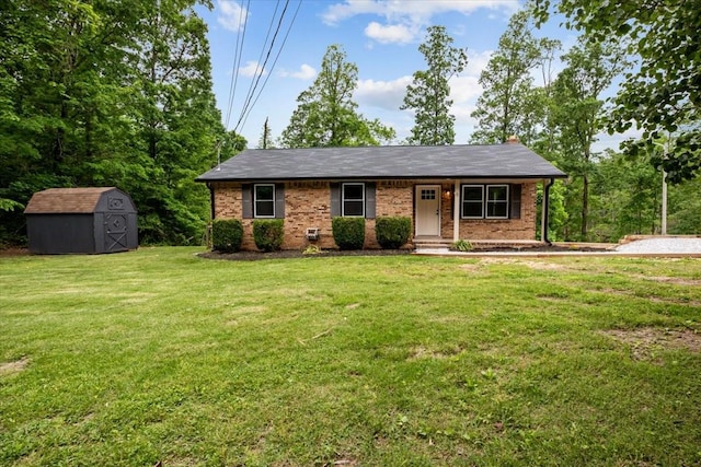 1079 Hillcrest Rd, Waverly, TN 37185 - view of front of home with a storage shed, a front lawn, an outbuilding, and brick siding