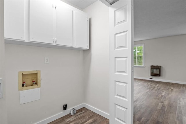 1079 Hillcrest Rd, Waverly, TN 37185 - clothes washing area featuring cabinet space, washer hookup, dark wood-style flooring, heating unit, and baseboards