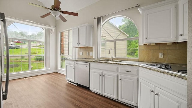 517 Eversholt Ct, Antioch, TN 37013 - kitchen featuring a sink, dishwasher, electric stovetop, white cabinetry, and dark wood-style floors