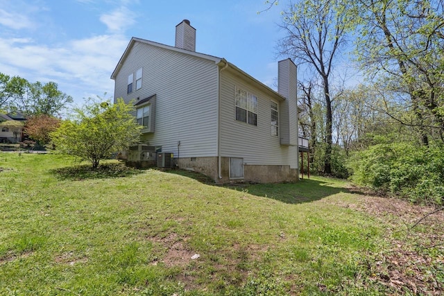 517 Eversholt Ct, Antioch, TN 37013 - view of side of home with a chimney, a yard, and cooling unit