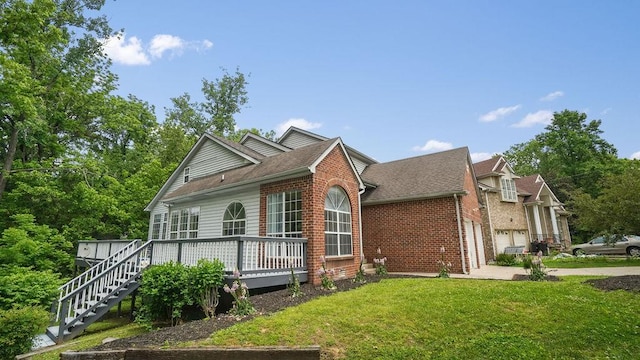 517 Eversholt Ct, Antioch, TN 37013 - view of front facade featuring brick siding, a front yard, a garage, stairway, and a deck
