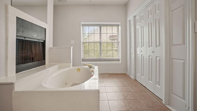 517 Eversholt Ct, Antioch, TN 37013 - bathroom featuring a whirlpool tub and tile patterned floors