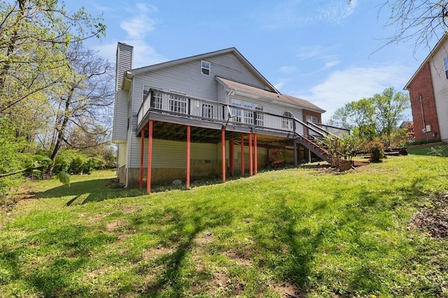 517 Eversholt Ct, Antioch, TN 37013 - rear view of house with a deck, a chimney, stairway, and a yard