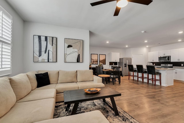 5312 Owens Ln, White House, TN 37188 - living area featuring light wood-style floors, plenty of natural light, a ceiling fan, and recessed lighting