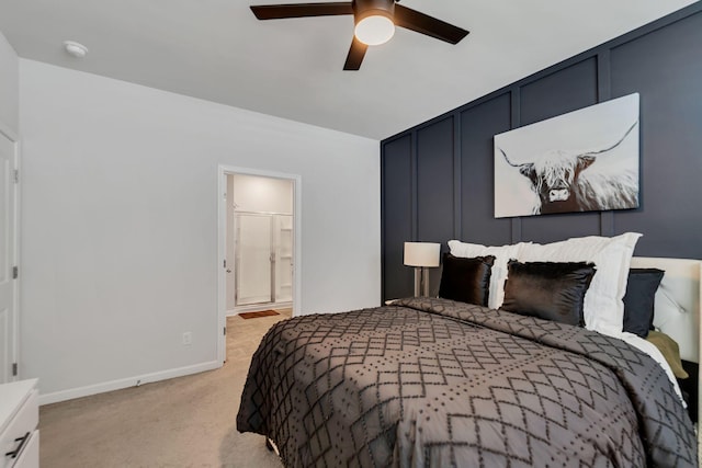 5312 Owens Ln, White House, TN 37188 - bedroom featuring light colored carpet, baseboards, ensuite bath, and a ceiling fan