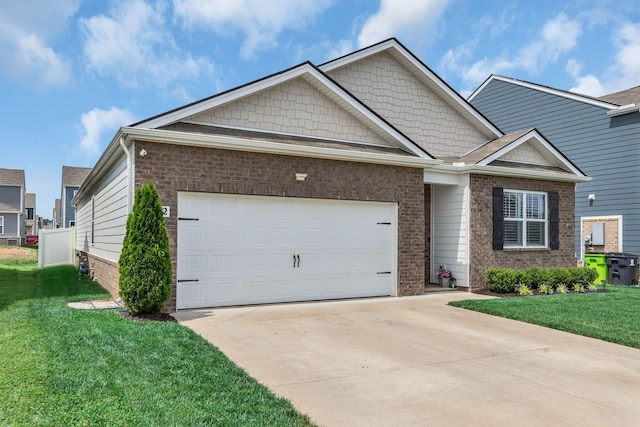 5312 Owens Ln, White House, TN 37188 - view of front of house with concrete driveway, a garage, a front lawn, and brick siding