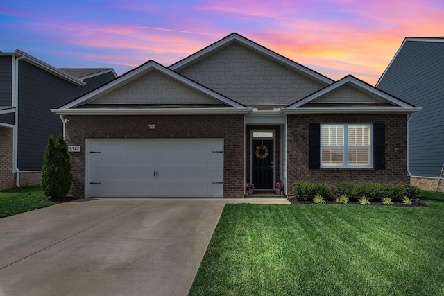 5312 Owens Ln, White House, TN 37188 - view of front of home featuring a yard, a garage, concrete driveway, and brick siding