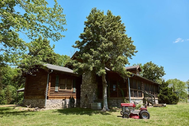 1794 Mosley Ferry Rd, Chapmansboro, TN 37035 - view of front of property with a front yard and a sunroom