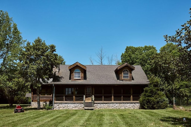 1794 Mosley Ferry Rd, Chapmansboro, TN 37035 - back of property with a sunroom, a lawn, and a shingled roof