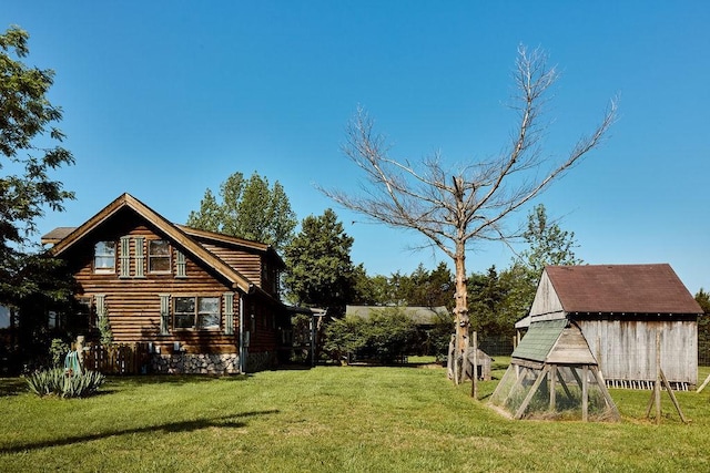 1794 Mosley Ferry Rd, Chapmansboro, TN 37035 - view of grassy yard featuring an outbuilding and a shed