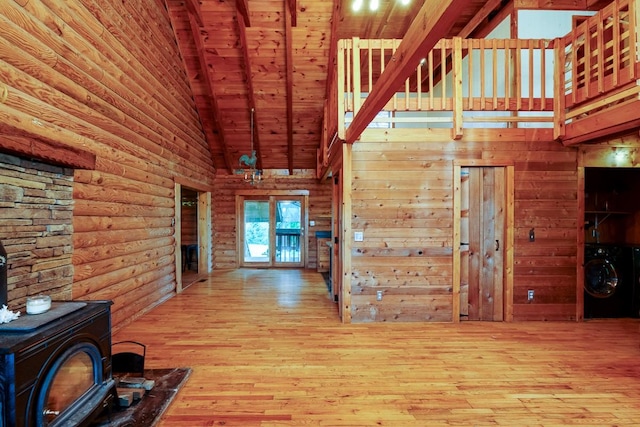 1794 Mosley Ferry Rd, Chapmansboro, TN 37035 - hallway with high vaulted ceiling, washer / clothes dryer, wood finished floors, wooden ceiling, and rustic walls