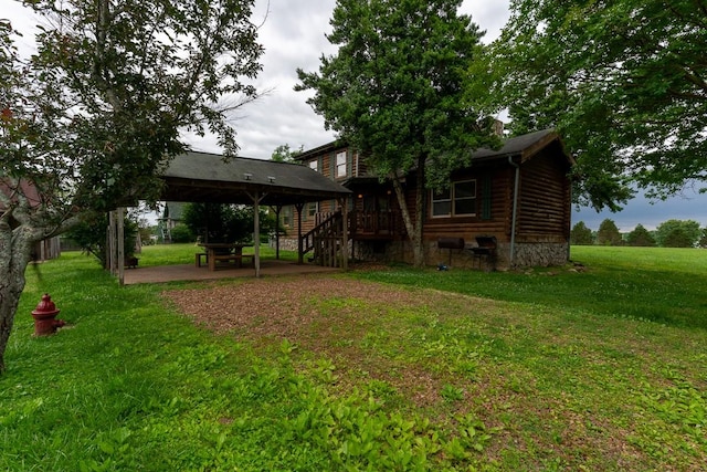 1794 Mosley Ferry Rd, Chapmansboro, TN 37035 - rear view of property featuring a lawn, a patio, a gazebo, and log exterior
