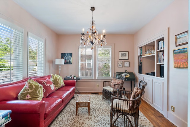 2209 Natchez Trce, Nashville, TN 37212 - living area featuring healthy amount of natural light, a chandelier, wood finished floors, and baseboards
