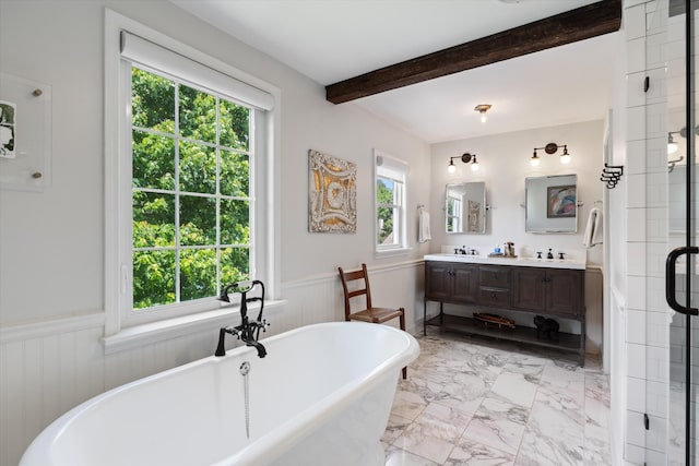 2209 Natchez Trce, Nashville, TN 37212 - bathroom with beamed ceiling, marble finish flooring, wainscoting, double vanity, and a freestanding tub