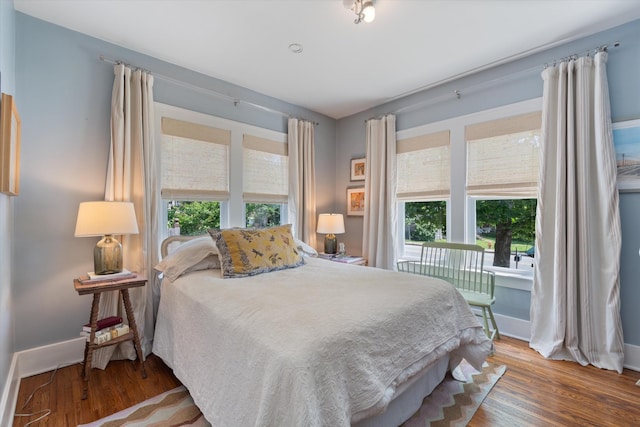 2209 Natchez Trce, Nashville, TN 37212 - bedroom with access to exterior, baseboards, and wood finished floors