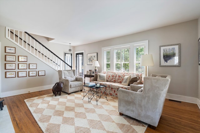2209 Natchez Trce, Nashville, TN 37212 - living area featuring stairway, wood finished floors, and baseboards