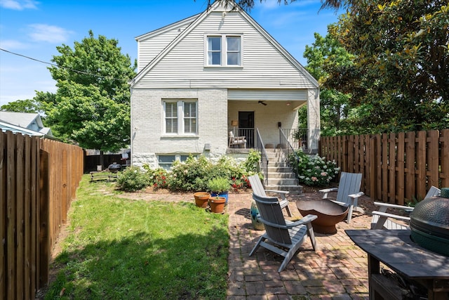 2209 Natchez Trce, Nashville, TN 37212 - rear view of property with brick siding, a fire pit, stairway, and a patio