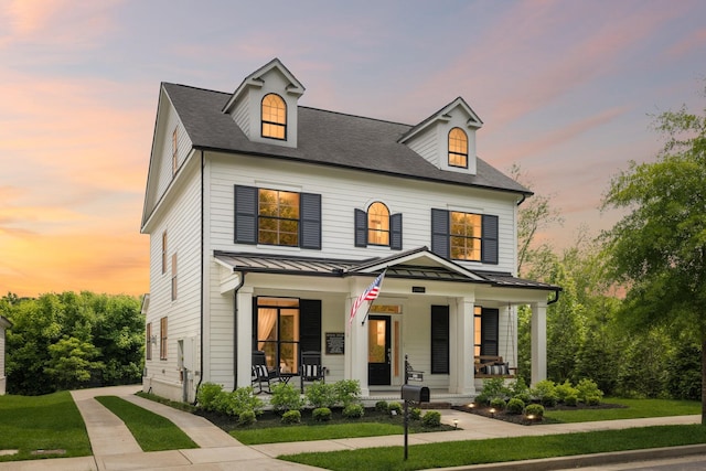 2060 Bushnell Farm Dr, Franklin, TN 37064 - view of front of home featuring a porch, a standing seam roof, metal roof, and a yard