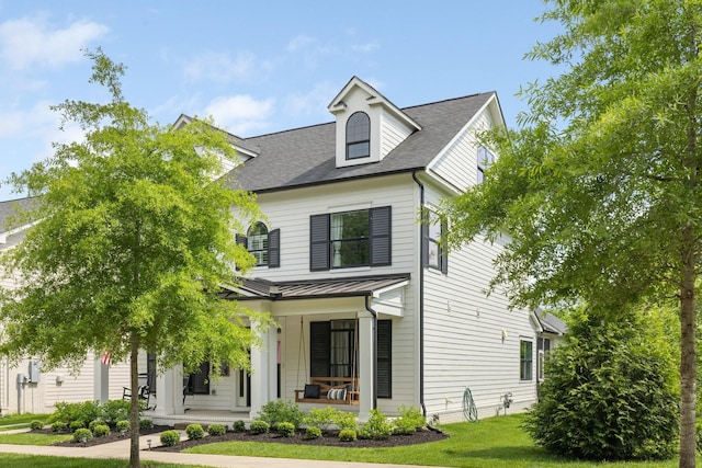 2060 Bushnell Farm Dr, Franklin, TN 37064 - view of front of property featuring covered porch, a standing seam roof, a front yard, metal roof, and roof with shingles
