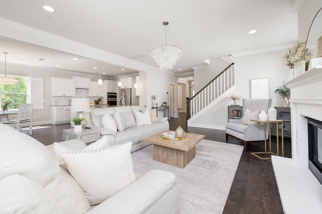 2060 Bushnell Farm Dr, Franklin, TN 37064 - living area featuring dark wood-type flooring, recessed lighting, a fireplace, stairway, and a chandelier