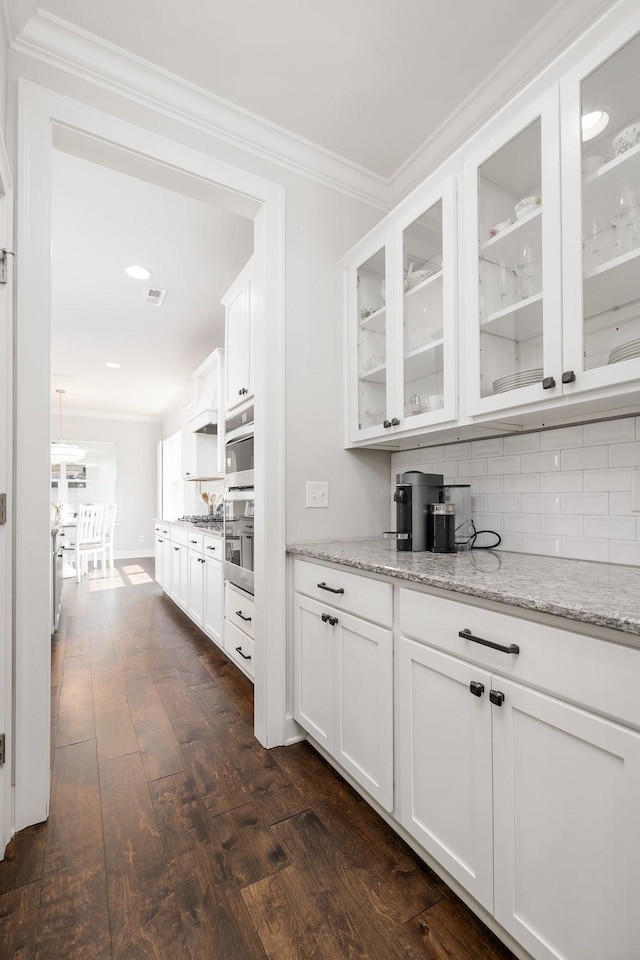 2060 Bushnell Farm Dr, Franklin, TN 37064 - bar with stainless steel appliances, dark wood finished floors, decorative backsplash, crown molding, and recessed lighting