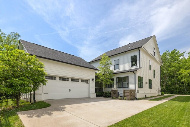 2060 Bushnell Farm Dr, Franklin, TN 37064 - view of front of home featuring a garage, concrete driveway, and an outdoor structure