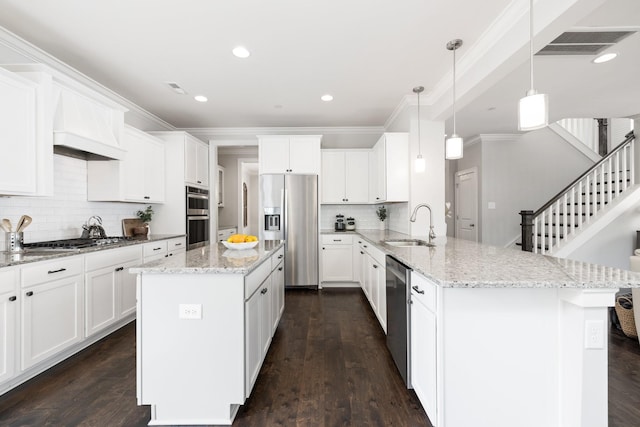 2060 Bushnell Farm Dr, Franklin, TN 37064 - kitchen featuring appliances with stainless steel finishes, a sink, a peninsula, ornamental molding, and decorative backsplash