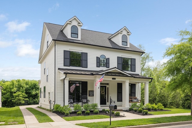 2060 Bushnell Farm Dr, Franklin, TN 37064 - view of front of property with a porch, a standing seam roof, metal roof, roof with shingles, and a front lawn
