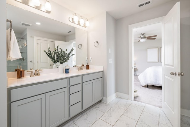 2060 Bushnell Farm Dr, Franklin, TN 37064 - full bath with double vanity, a ceiling fan, ensuite bath, marble look tile flooring, and baseboards