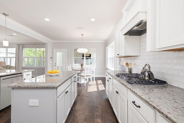 2060 Bushnell Farm Dr, Franklin, TN 37064 - kitchen with appliances with stainless steel finishes, a center island, decorative backsplash, dark wood-type flooring, and white cabinets