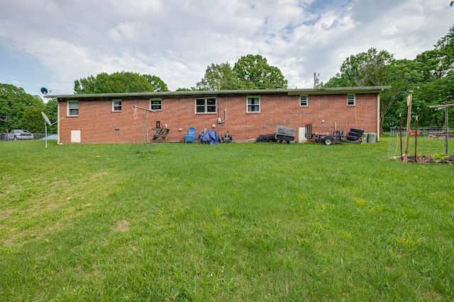 470 Arlington St, Erin, TN 37061 - rear view of property with a yard and brick siding