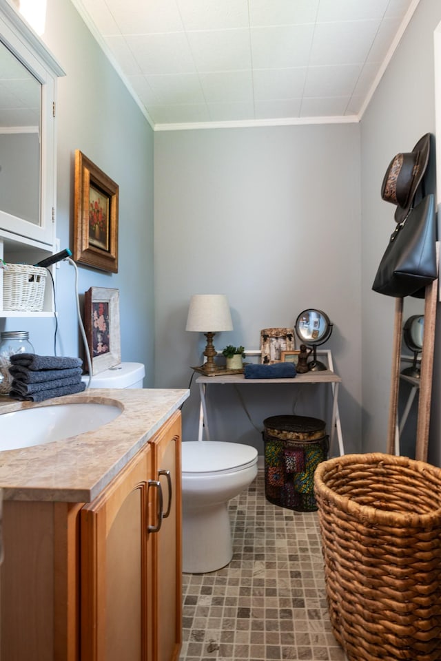 470 Arlington St, Erin, TN 37061 - half bathroom featuring ornamental molding, vanity, and toilet