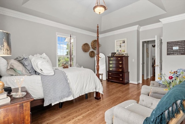 495 Baker Rd, Dickson, TN 37055 - bedroom featuring wood finished floors, a tray ceiling, crown molding, and baseboards