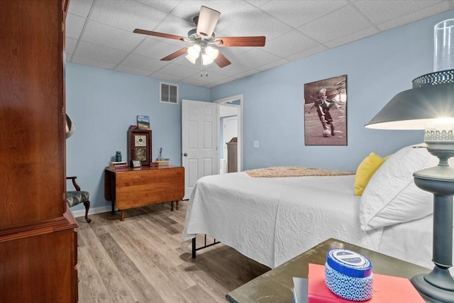 495 Baker Rd, Dickson, TN 37055 - bedroom featuring wood finished floors, a paneled ceiling, and a ceiling fan