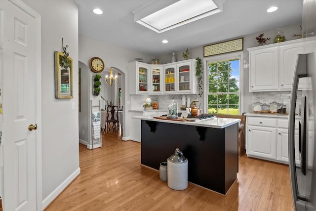 495 Baker Rd, Dickson, TN 37055 - kitchen featuring stainless steel refrigerator with ice dispenser, light countertops, white cabinets, and recessed lighting