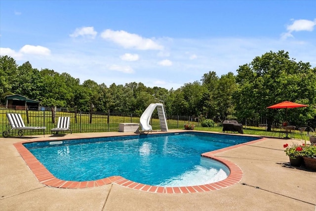495 Baker Rd, Dickson, TN 37055 - view of pool featuring a water slide, a patio, and view of wooded area