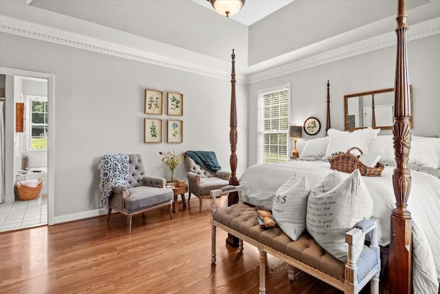 495 Baker Rd, Dickson, TN 37055 - bedroom with multiple windows, light wood-type flooring, baseboards, ornamental molding, and ensuite bathroom