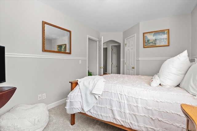 495 Baker Rd, Dickson, TN 37055 - carpeted bedroom with arched walkways and baseboards