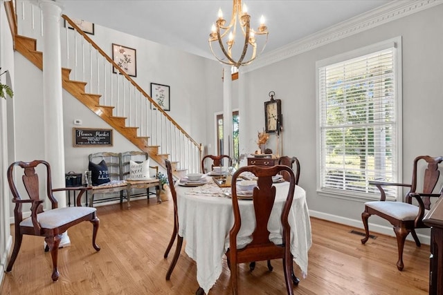 495 Baker Rd, Dickson, TN 37055 - dining area with stairway, a chandelier, healthy amount of natural light, and ornamental molding