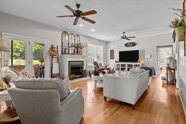 495 Baker Rd, Dickson, TN 37055 - living room featuring a fireplace with raised hearth, a ceiling fan, light wood-style floors, and recessed lighting