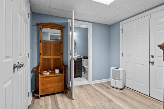 495 Baker Rd, Dickson, TN 37055 - foyer featuring light wood-type flooring, a drop ceiling, and baseboards